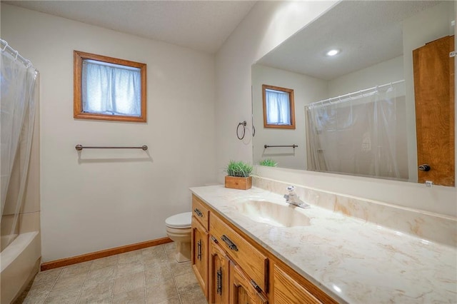 1101 Jeff Cir, Paola, KS 66071 - bathroom featuring baseboards, vanity, toilet, and shower / bath combo with shower curtain