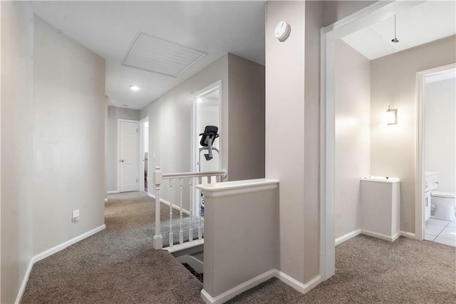 7710 Noland Rd, Lenexa, KS 66216 - corridor featuring an upstairs landing, carpet, and baseboards