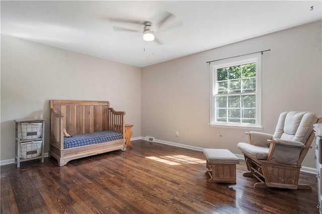 7710 Noland Rd, Lenexa, KS 66216 - bedroom featuring wood finished floors, baseboards, and a ceiling fan