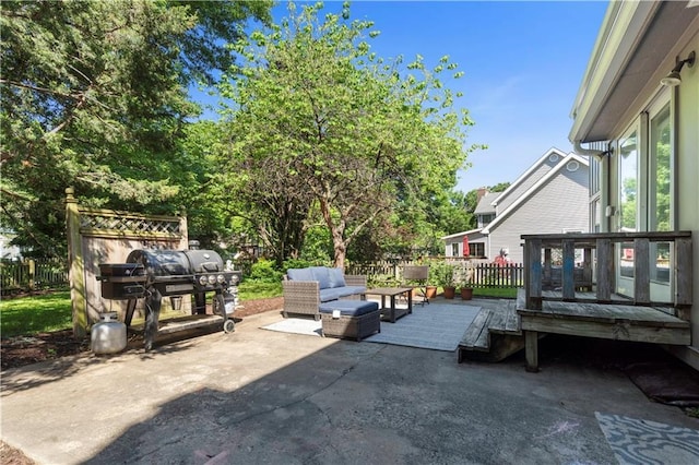 7710 Noland Rd, Lenexa, KS 66216 - view of patio featuring an outdoor hangout area and a wooden deck