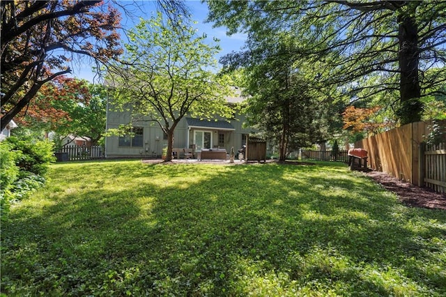 7710 Noland Rd, Lenexa, KS 66216 - view of yard featuring a jacuzzi and a patio area