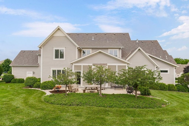 10309 S Oakcrest Ln, Olathe, KS 66061 - back of house featuring a patio area, a shingled roof, and a yard