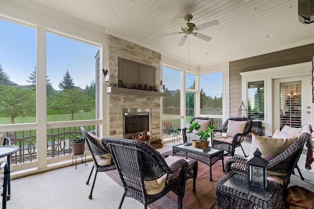 10309 S Oakcrest Ln, Olathe, KS 66061 - sunroom with ceiling fan, crown molding, an outdoor living space with a fireplace, wooden ceiling, and healthy amount of natural light