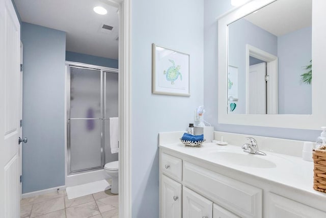 10309 S Oakcrest Ln, Olathe, KS 66061 - full bathroom with vanity, toilet, a shower stall, and baseboards