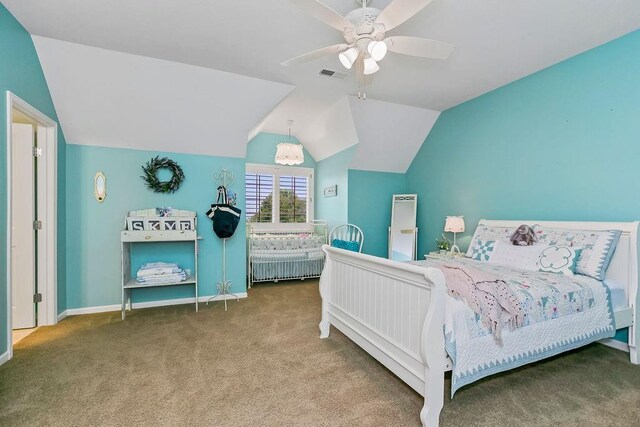 10309 S Oakcrest Ln, Olathe, KS 66061 - carpeted bedroom with lofted ceiling, a ceiling fan, and baseboards