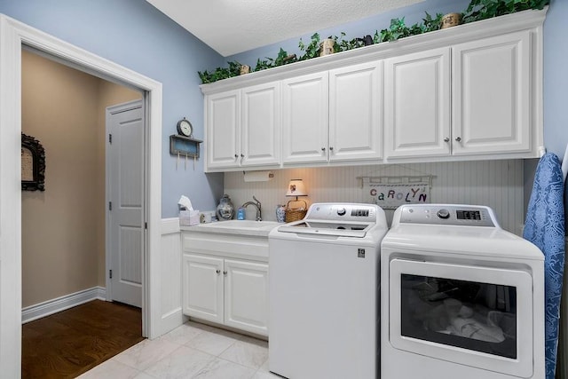 10309 S Oakcrest Ln, Olathe, KS 66061 - laundry area with washing machine and clothes dryer and cabinet space