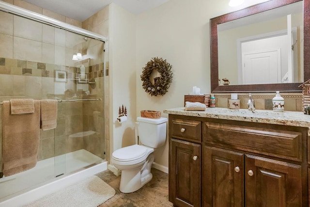 10309 S Oakcrest Ln, Olathe, KS 66061 - full bath featuring toilet, a stall shower, vanity, and baseboards