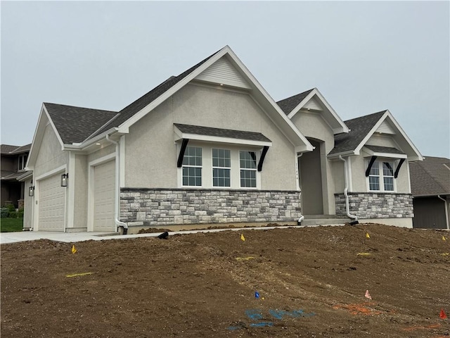 11494 S Longview Rd, Olathe, KS 66061 - view of front of home with stucco siding, a garage, stone siding, and a shingled roof