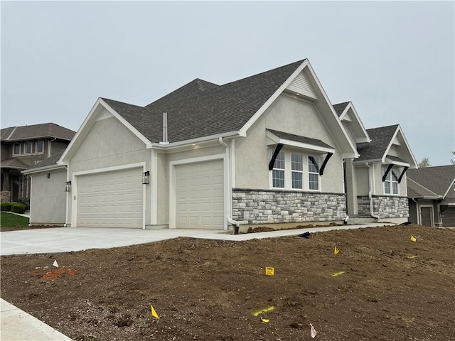 11494 S Longview Rd, Olathe, KS 66061 - view of front facade featuring stucco siding, stone siding, an attached garage, driveway, and roof with shingles