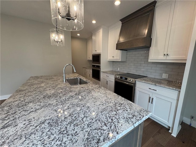 11494 S Longview Rd, Olathe, KS 66061 - kitchen featuring appliances with stainless steel finishes, a sink, premium range hood, a chandelier, and dark wood finished floors