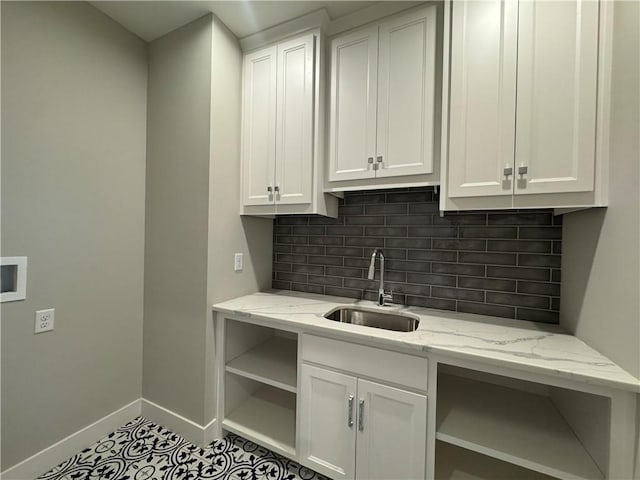 11494 S Longview Rd, Olathe, KS 66061 - kitchen with open shelves, a sink, baseboards, white cabinets, and decorative backsplash