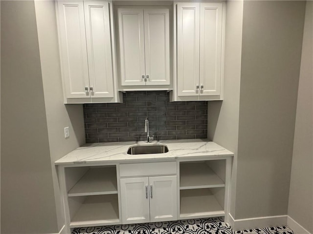 11494 S Longview Rd, Olathe, KS 66061 - kitchen featuring open shelves, a sink, baseboards, backsplash, and white cabinets