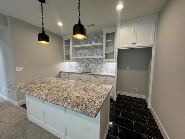 11494 S Longview Rd, Olathe, KS 66061 - kitchen featuring a sink, a kitchen island, white cabinetry, baseboards, and recessed lighting