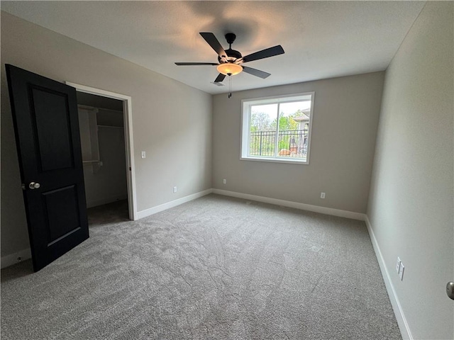 11494 S Longview Rd, Olathe, KS 66061 - unfurnished bedroom with carpet, baseboards, and a ceiling fan