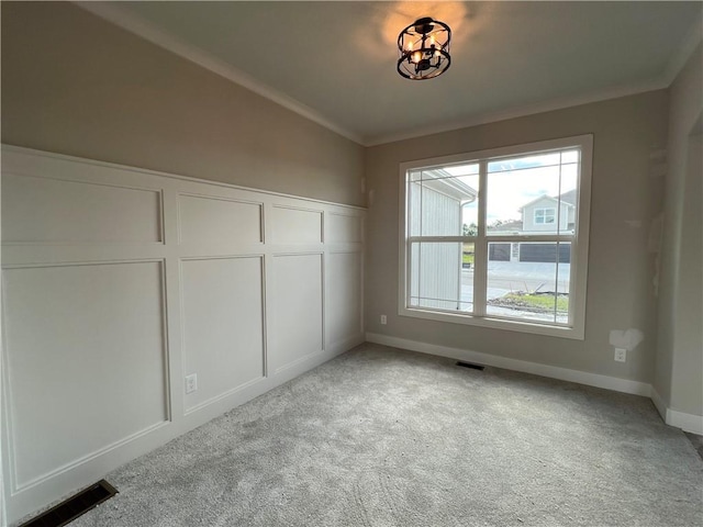 16977 S Mahaffie St, Olathe, KS 66062 - unfurnished bedroom with light carpet, baseboards, a closet, and crown molding