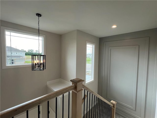 16977 S Mahaffie St, Olathe, KS 66062 - hall featuring a chandelier, an upstairs landing, plenty of natural light, and recessed lighting