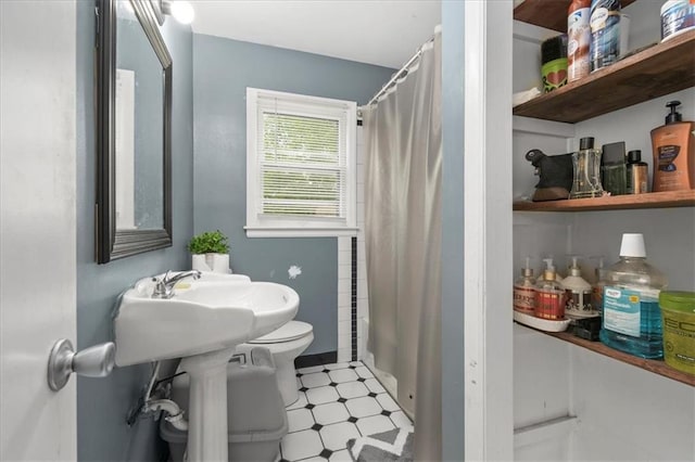 6014 Kentucky Rd, Raytown, MO 64133 - full bathroom featuring toilet, a shower with curtain, and tile patterned floors