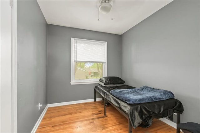 6014 Kentucky Rd, Raytown, MO 64133 - bedroom with light wood-style floors, baseboards, and a ceiling fan
