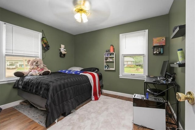 6014 Kentucky Rd, Raytown, MO 64133 - bedroom featuring wood finished floors, baseboards, and a ceiling fan