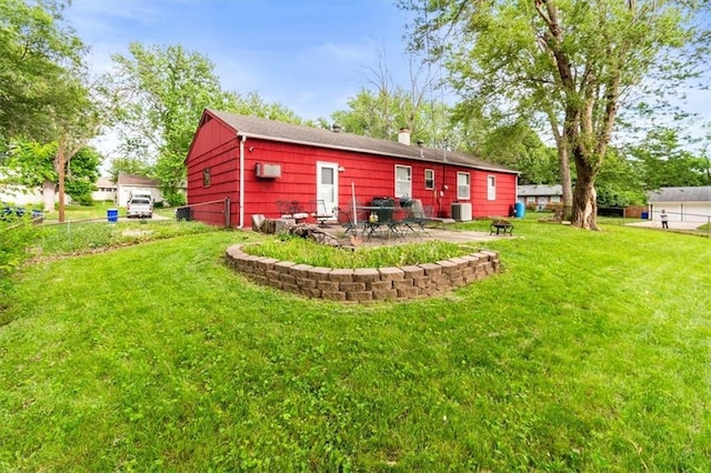 6014 Kentucky Rd, Raytown, MO 64133 - rear view of house featuring central air condition unit, a chimney, and a patio area