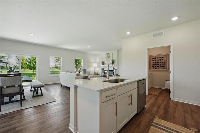 24810 178th Ct, Gardner, KS 66030 - kitchen with a sink, stainless steel dishwasher, open floor plan, light countertops, and dark wood-style flooring