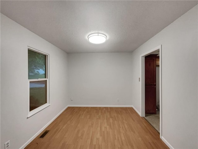 131 Brookridge St, Lansing, KS 66043 - spare room with light wood-style floors, a textured ceiling, and baseboards