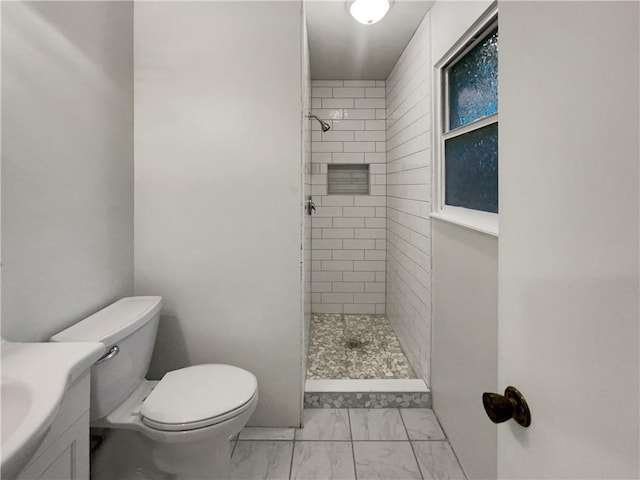 131 Brookridge St, Lansing, KS 66043 - full bath with marble look tiles, a tile shower, toilet, and vanity