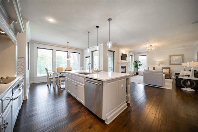 9101 W 158th St, Overland Park, KS 66221 - kitchen with a sink, stainless steel dishwasher, a kitchen island with sink, open floor plan, and crown molding