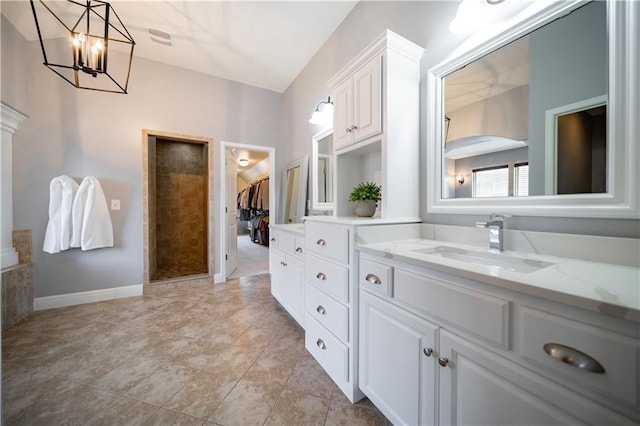 9101 W 158th St, Overland Park, KS 66221 - full bath with vanity, a chandelier, and baseboards