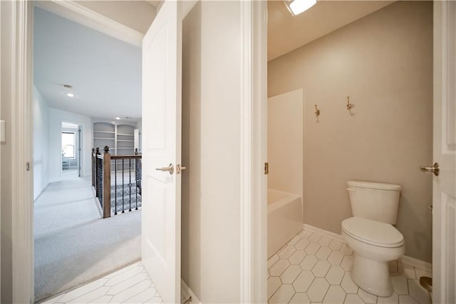9101 W 158th St, Overland Park, KS 66221 - bathroom featuring toilet, a bath, tile patterned floors, and baseboards