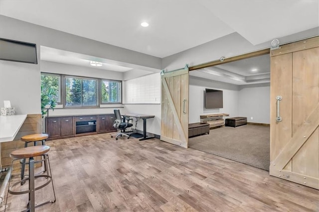 9101 W 158th St, Overland Park, KS 66221 - interior space featuring a barn door, light wood finished floors, baseboards, and recessed lighting