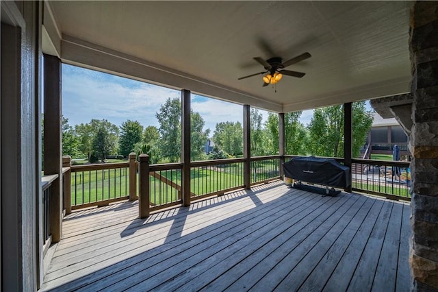9101 W 158th St, Overland Park, KS 66221 - wooden deck featuring ceiling fan, view of scattered trees, and grilling area