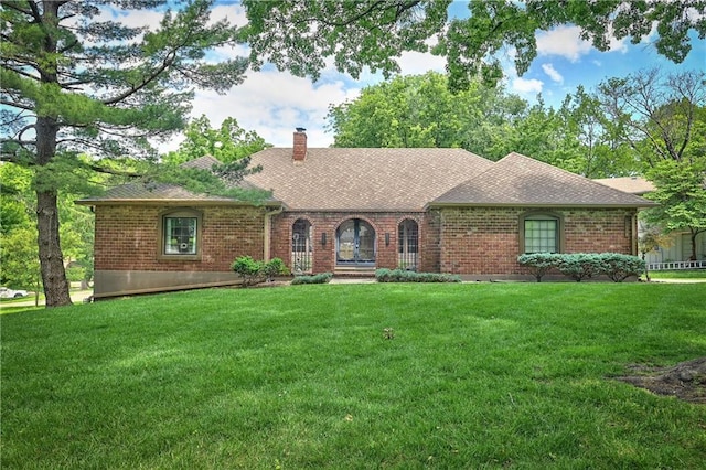 12614 Ensley Ln, Leawood, KS 66209 - view of front facade with brick siding, a chimney, and a shingled roof