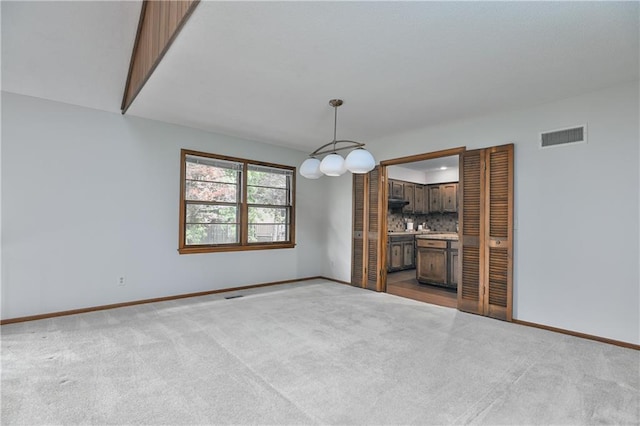 12614 Ensley Ln, Leawood, KS 66209 - unfurnished living room featuring carpet floors and baseboards