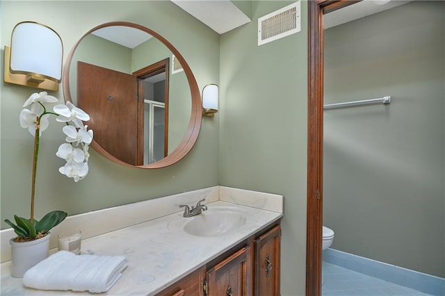 12614 Ensley Ln, Leawood, KS 66209 - full bathroom with vanity, toilet, and tile patterned floors
