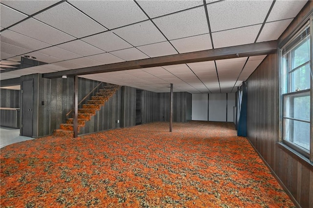 12614 Ensley Ln, Leawood, KS 66209 - basement with wooden walls, carpet flooring, and stairway
