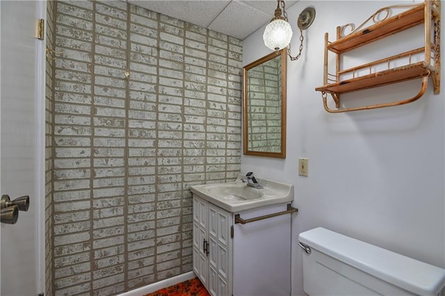 12614 Ensley Ln, Leawood, KS 66209 - bathroom featuring a drop ceiling, toilet, and vanity