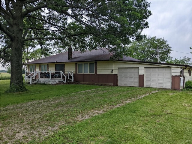 564 SE 251st Rd, Warrensburg, MO 64093 - ranch-style house with a chimney, a front yard, driveway, a wooden deck, and an attached garage