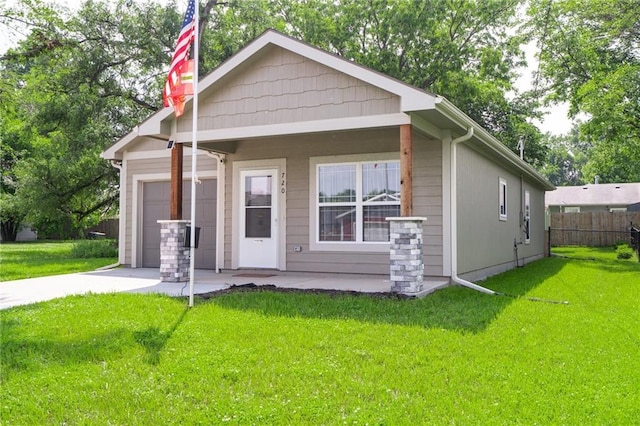 720 S Funston St, Ottawa, KS 66067 - bungalow-style house featuring driveway and an attached garage