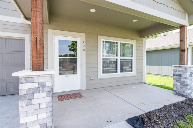 720 S Funston St, Ottawa, KS 66067 - property entrance with a garage
