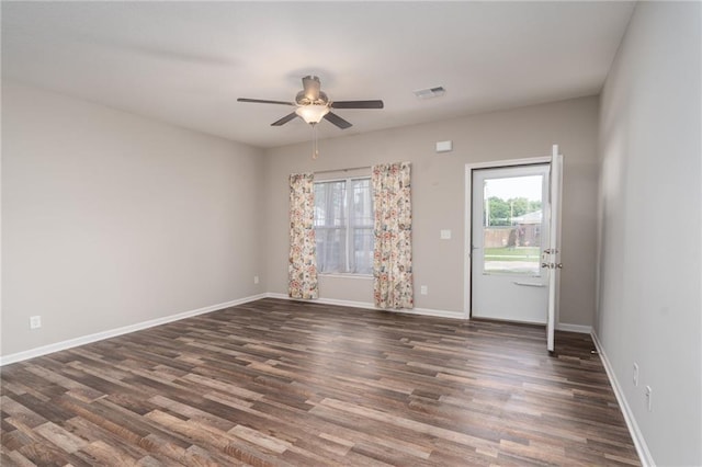 720 S Funston St, Ottawa, KS 66067 - unfurnished room featuring ceiling fan, wood finished floors, and baseboards