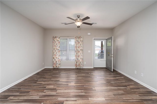 720 S Funston St, Ottawa, KS 66067 - unfurnished room with a ceiling fan, baseboards, and wood finished floors
