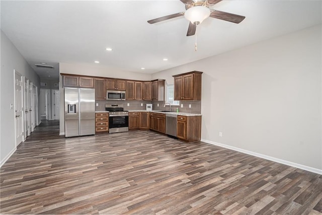 720 S Funston St, Ottawa, KS 66067 - kitchen with appliances with stainless steel finishes, dark wood-style floors, light countertops, baseboards, and ceiling fan