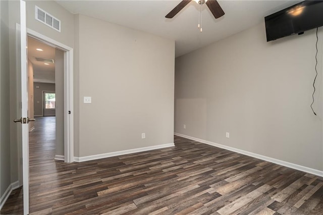 720 S Funston St, Ottawa, KS 66067 - spare room featuring dark wood-style floors, ceiling fan, and baseboards