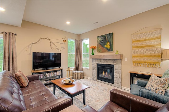 214 N Mcgee St, Tonganoxie, KS 66086 - living room featuring recessed lighting, a glass covered fireplace, and baseboards