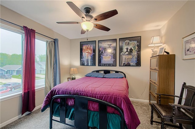214 N Mcgee St, Tonganoxie, KS 66086 - carpeted bedroom with baseboards and a ceiling fan