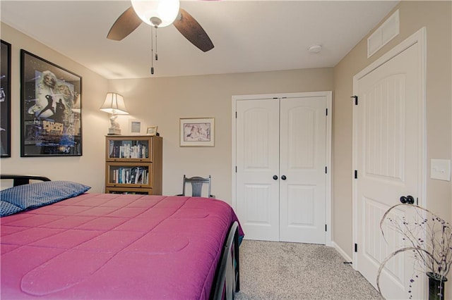 214 N Mcgee St, Tonganoxie, KS 66086 - carpeted bedroom with a closet, a ceiling fan, and baseboards