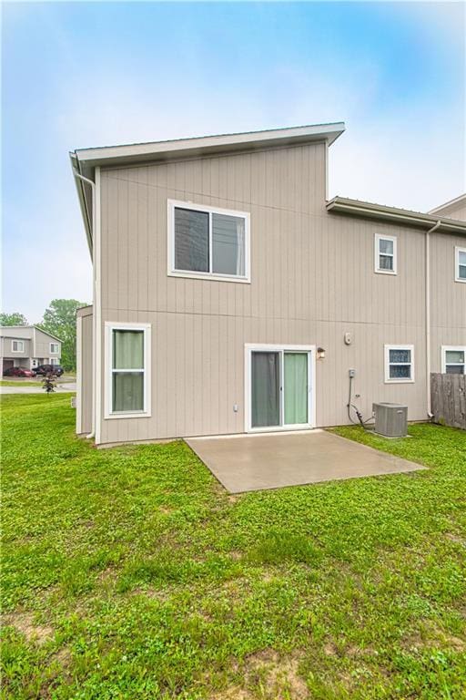 214 N Mcgee St, Tonganoxie, KS 66086 - back of house featuring a patio area and cooling unit