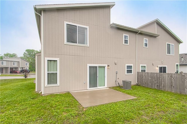 214 N Mcgee St, Tonganoxie, KS 66086 - rear view of house with central AC unit and a patio area