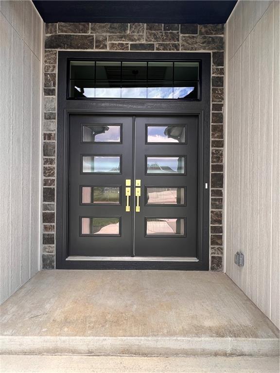 16311 Mustang St, Gardner, KS 66030 - entrance to property with stone siding